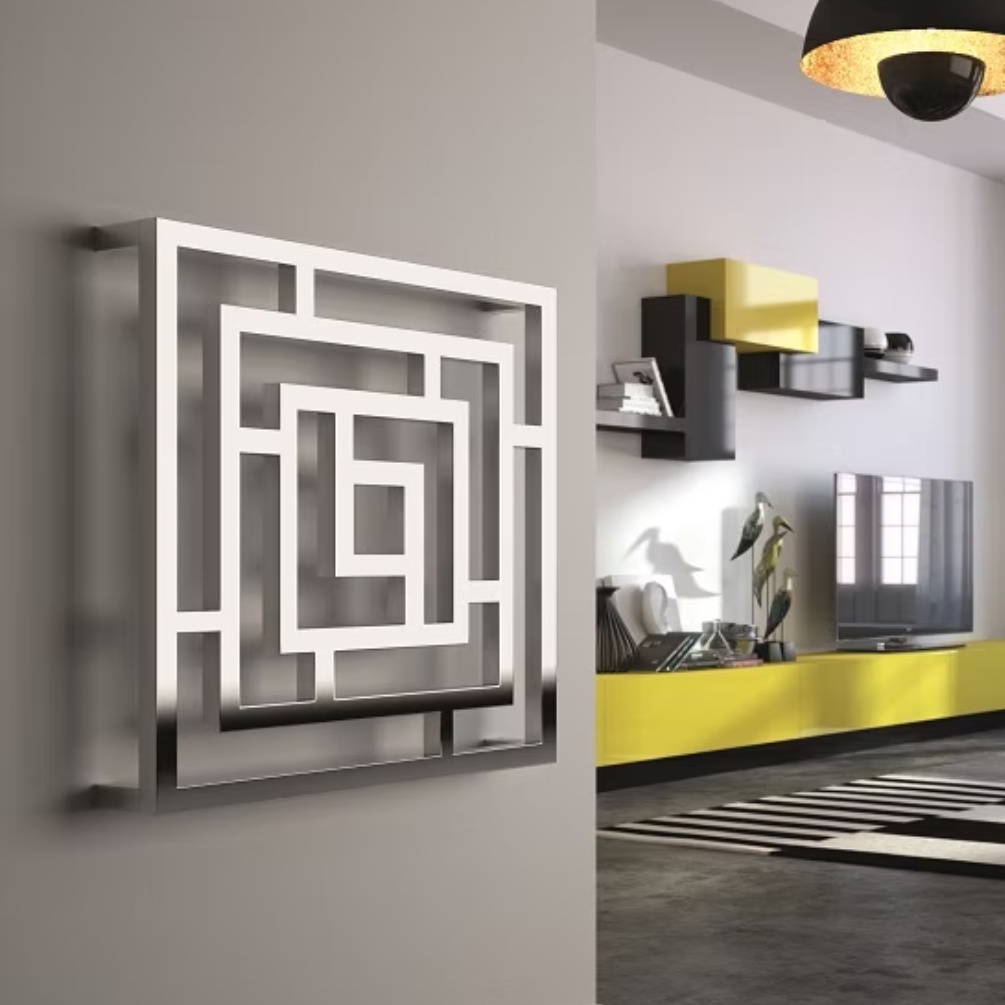 Lifestyle image of the Radox Maze 690mm x 690mm Chrome Designer Heated Radiator mounted on a grey wall in a spacious modern room